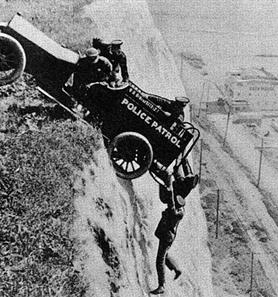 Old footage of a police car going over cliff